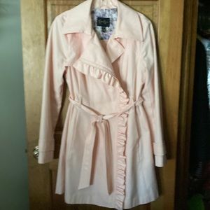 Pink ruffle front trench coat